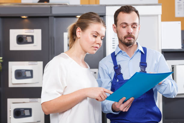 istock Man showing catalog to female client 1080741888