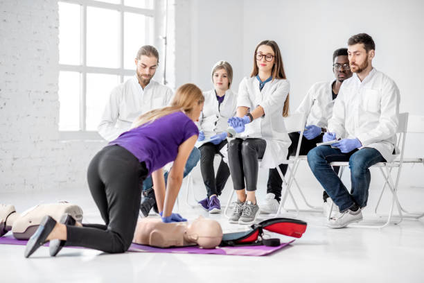 istock Group of medics during the first aid training indoors 1080741916