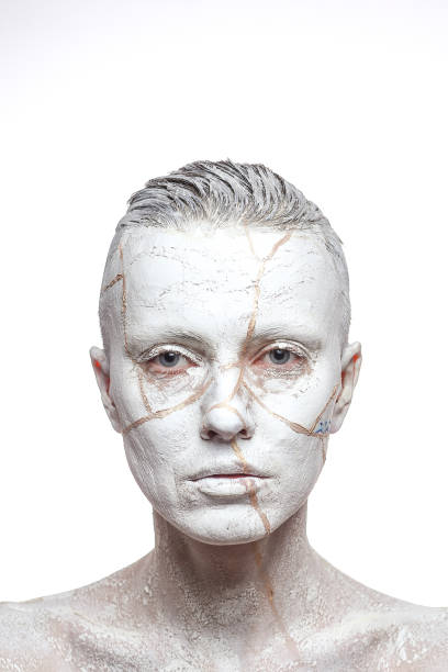 istock Beautiful woman with white clay on face 1080746324