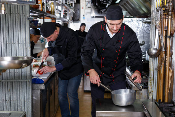istock Cheerful cooks at restaurant kitchen 1080747754