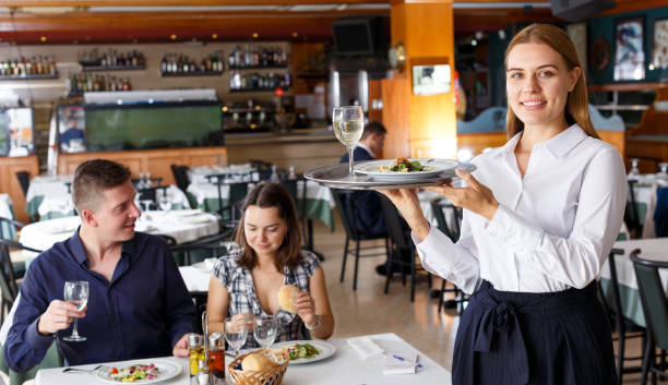 istock Positive waitress with tray 1080747766