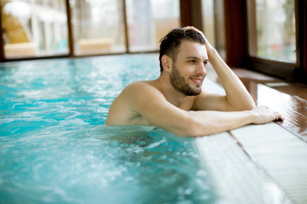 istock Handsome young man relaxing in hot tub 1080761000