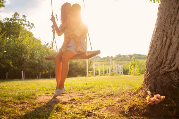 istock Beautiful woman enjoying on a swing 1080761156