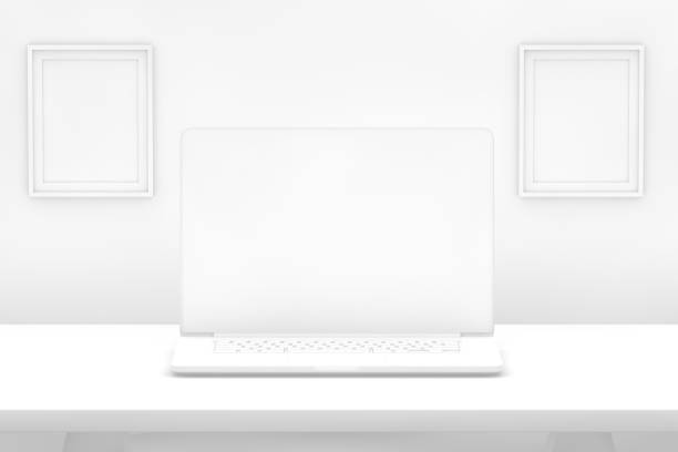istock Laptop with blank screen on desk with white background 1080762582