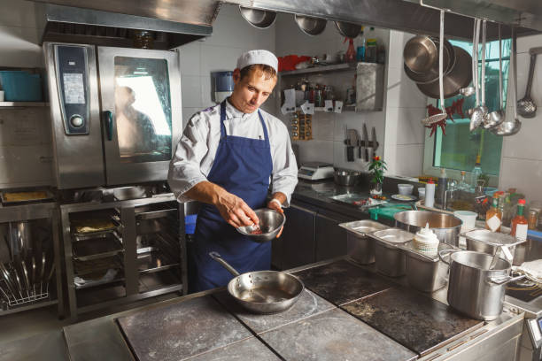 istock Chef cooking meat at restaurant or hotel kitchen 1080772122