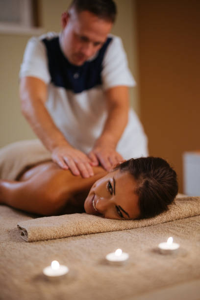 istock Young woman getting shoulder massage from a massage therapist 1080772630