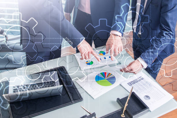 istock Double exposure gears mechanism on blurred background. Business and industrial process automation concept. 1080776010