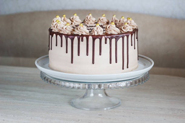 istock Chocolate Cake with Fudge Drizzled Icing and Curls 1080786564