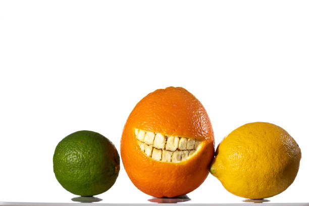 istock Orange with a cut smile in the skin, lemon and lime 1080793724