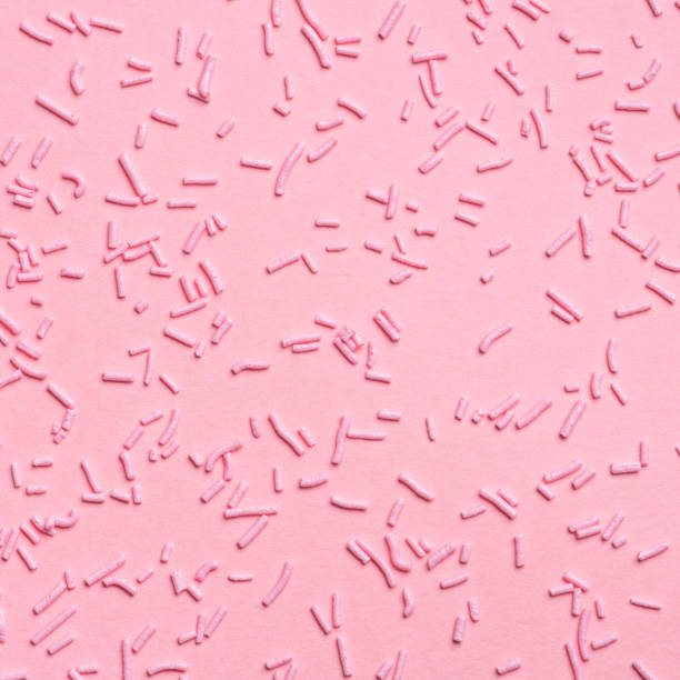 istock beautiful pink sprinkles dots on background, flat lay 1080795536