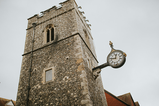 Traditional clock in St George's tower in Canterbury, Kent, England.