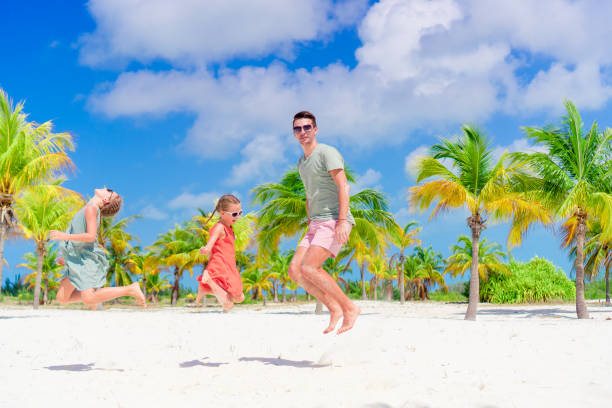 istock Father and kids enjoying beach summer vacation 1080801794