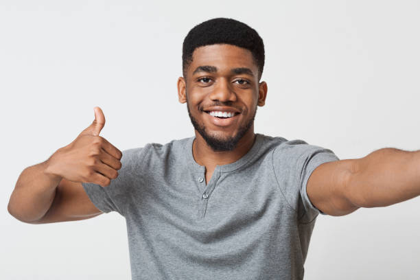 istock Happy man making selfie and showing thumb up 1080802112