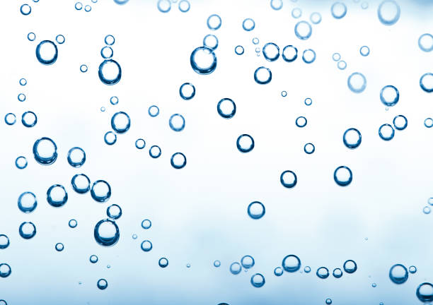 istock Macro bubbles of water on blue background 1080802922