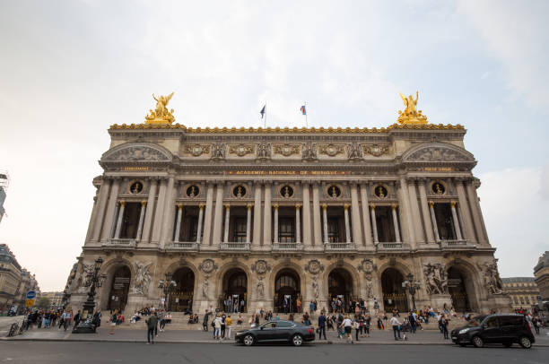 View of Place de l'Opera and Opera de Paris building. Grand Opera (Garnier Palace) is famous neo-baroque building in Paris, France Paris, France, September 5, 2018 - View of Place de l'Opera and Opera de Paris building. Grand Opera (Garnier Palace) is famous neo-baroque building in Paris, France place de lopera stock pictures, royalty-free photos & images