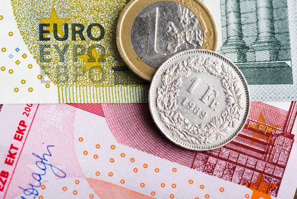 swiss franc versus euro - swiss currency imagens e fotografias de stock