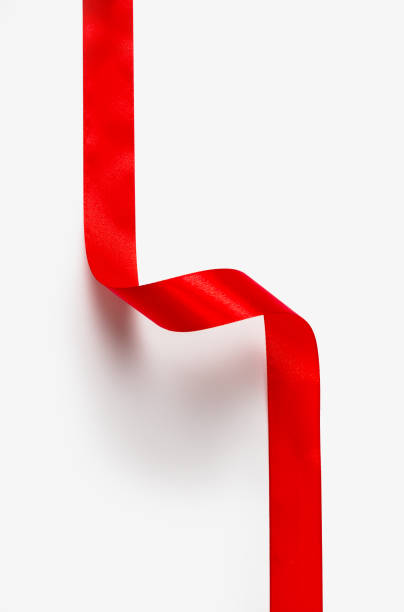 istock Red ribbon isolated corner on white 1080807970