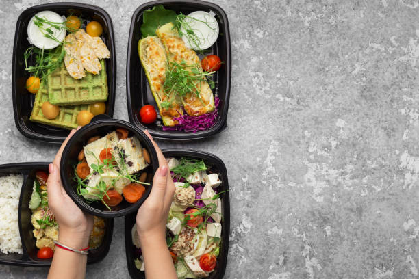 istock Plastic containers with delicious food on gray background 1080809526