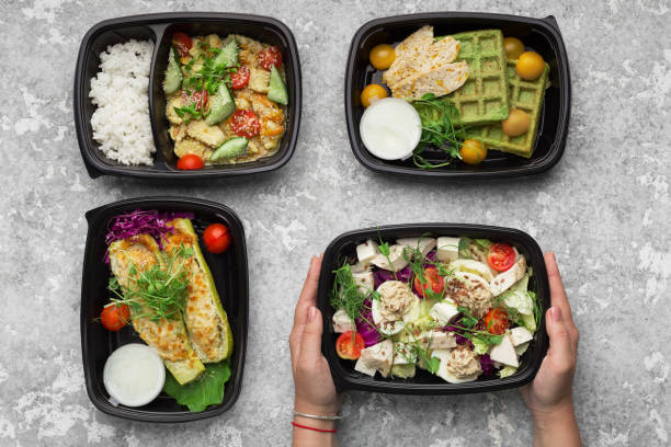 istock Plastic containers with delicious food on gray background 1080809550
