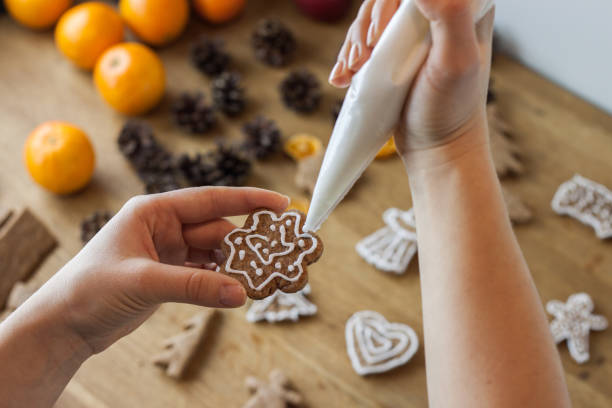 istock Christmas gingerbread icing decorating process. Homemade sweet cookies 1080817618