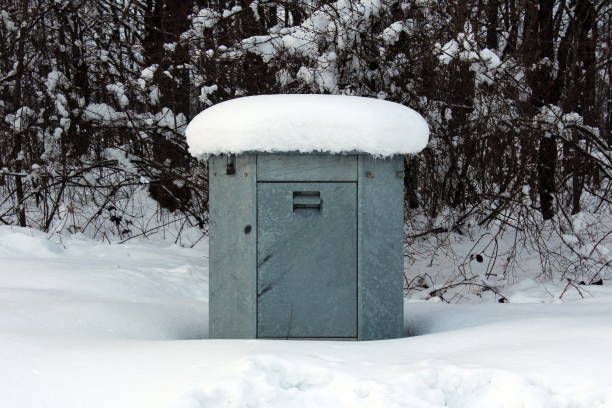 istock Outdoor electrical high voltage box covered with snow 1080857090