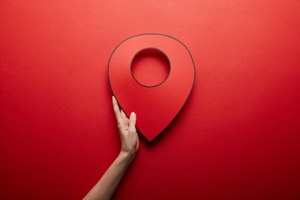 istock top view of red handmade geolocation symbol on red background 1080859000