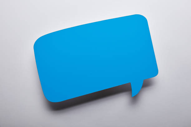istock top view of empty blue speech bubble on grey background 1080859034
