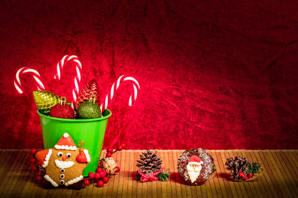 istock Candy canes with Christmas tree balls in a green pot 1080862462