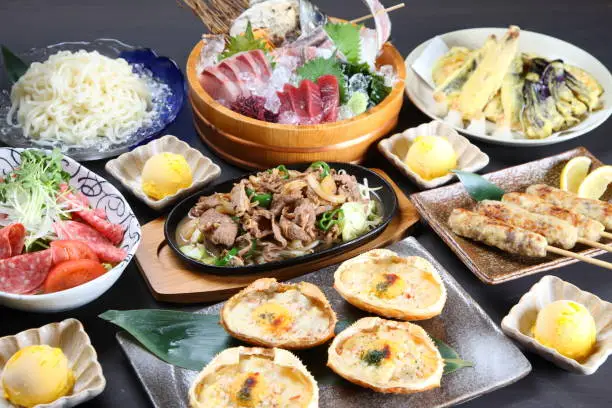 studio shot of various dishes of Japanese Izakaya menu