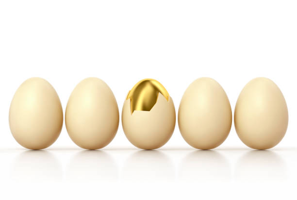 istock Golden egg with broken shell among usual chicken eggs in row 1080864486