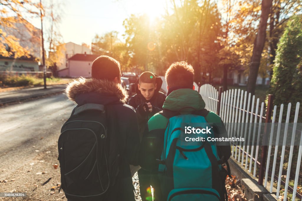 Way to school. Two angry teenage boys Bullying Stock Photo