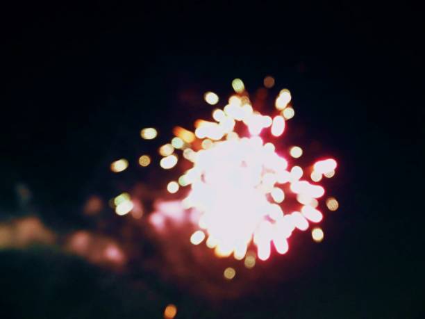 istock abstract, fireworks, blurred image. Christmas background. Light with glowing sparks, merry christmas greeting card 1080879880