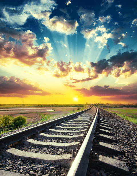 istock sunset in blue sky with clouds over railway to horizon 1080879900
