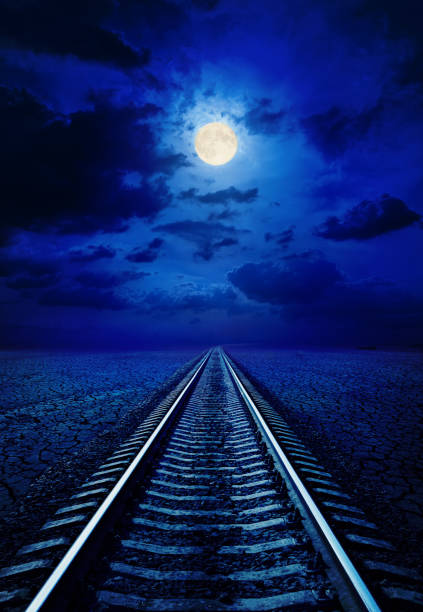 istock full moon in night sky with clouds over railroad 1080880014
