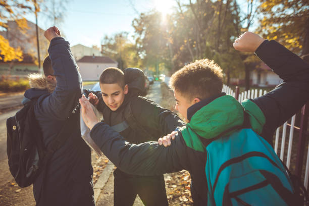 Way to school. Two angry teenage boys Way to school. Two angry teenage boys schoolyard fight stock pictures, royalty-free photos & images