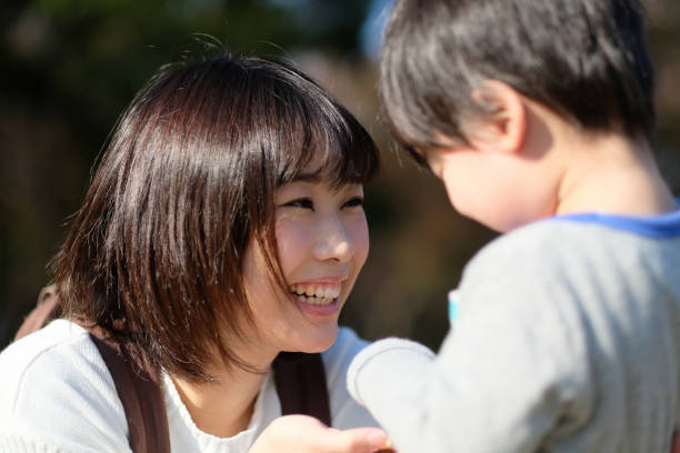 istock Mother talking to child in park 1080882742