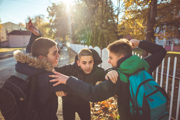 Way to school. Two angry teenage boys Way to school. Two angry teenage boys schoolyard fight stock pictures, royalty-free photos & images