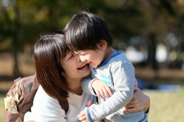 istock Mother talking to child in park 1080883038