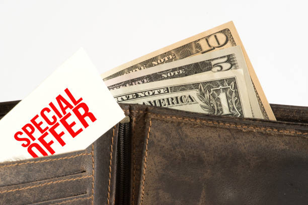 istock Dollar banknotes, purse and a note on special offer 1080887640