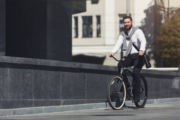 istock Handsome young businessman riding on his bicycle 1080888252