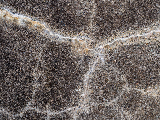 istock Abstract cracked concrete or cement texture wall or floor background. 1080892710