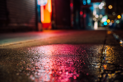street atmosphere, rainy street with reflections