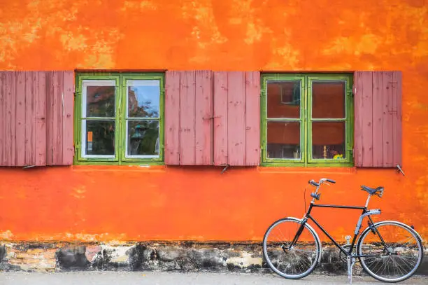 Orange wall and vintage bicycle windows in Copenhagen City