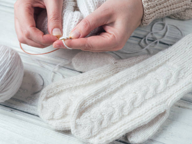 istock Woman knits winter warm clothes closeup 1080902664