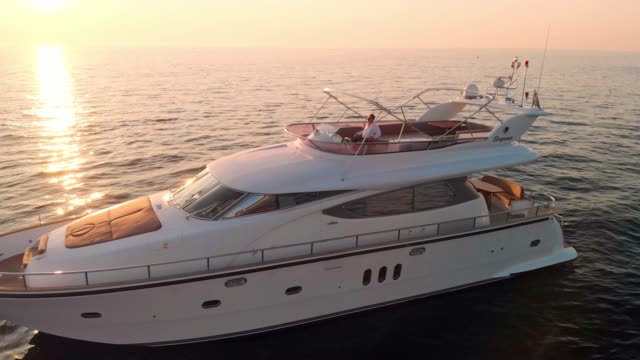 Sunset glory on the seaside - luxury yacht