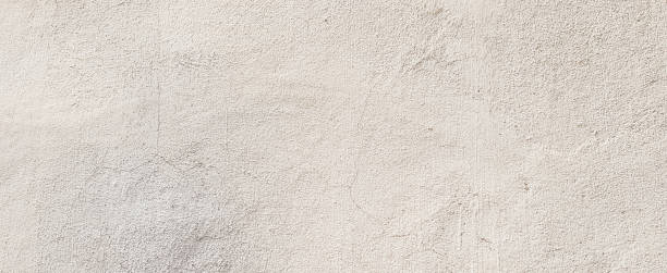 근접 촬영 된 표면 밝은 크림 시멘트 배경 텍스처 프레 젠 테이 션 또는 간단한 배너 광고 컨셉으로 디자인에 대 한 모의 - stucco wall textured textured effect 뉴스 사진 이미지