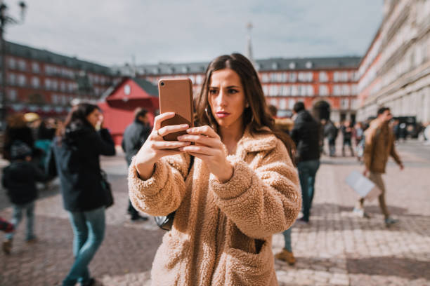 istock Young woman taking pictures at city 1080915744