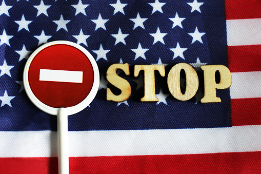 Road stop sign on a background of America flag, object