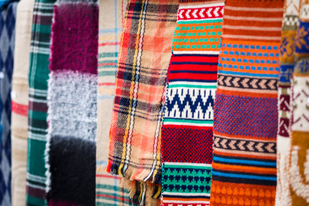 istock Multi colored womans winter shawls and scarves in a row 1080918086