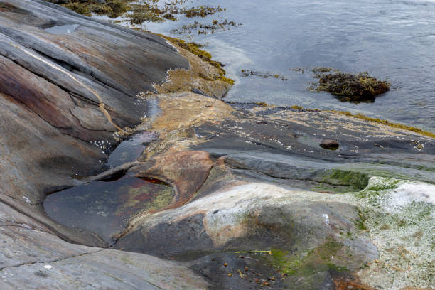 istock Beginning of a pothole created by tidal current in Northern Norway. 1080924066